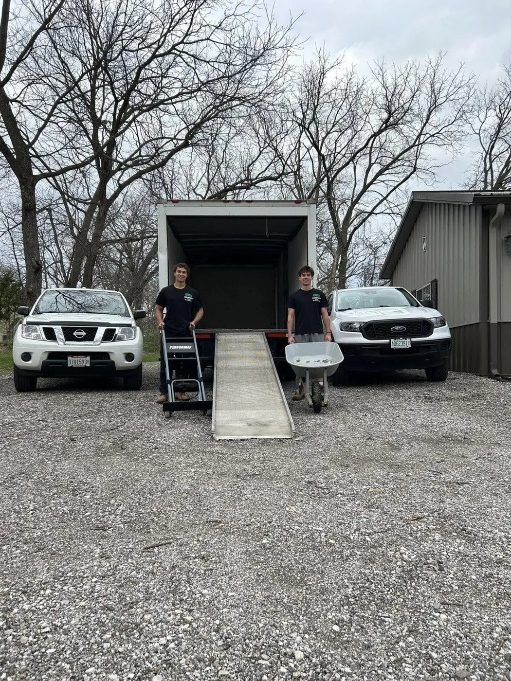 The ClearPath crew with a dolly and ramp at the back of the moving truck