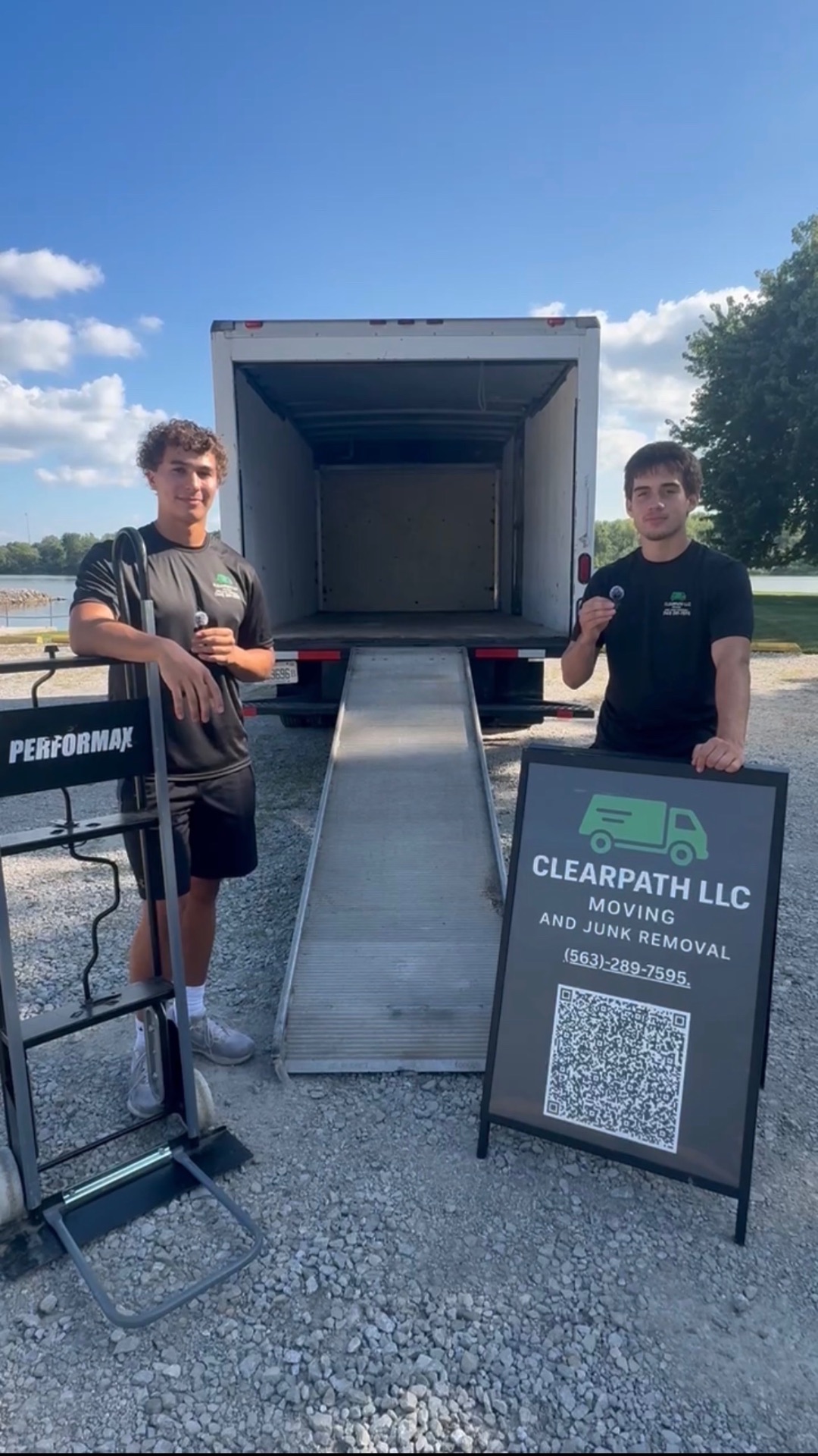 Quinn and Jacob, the owners of ClearPath, at the back of their moving truck