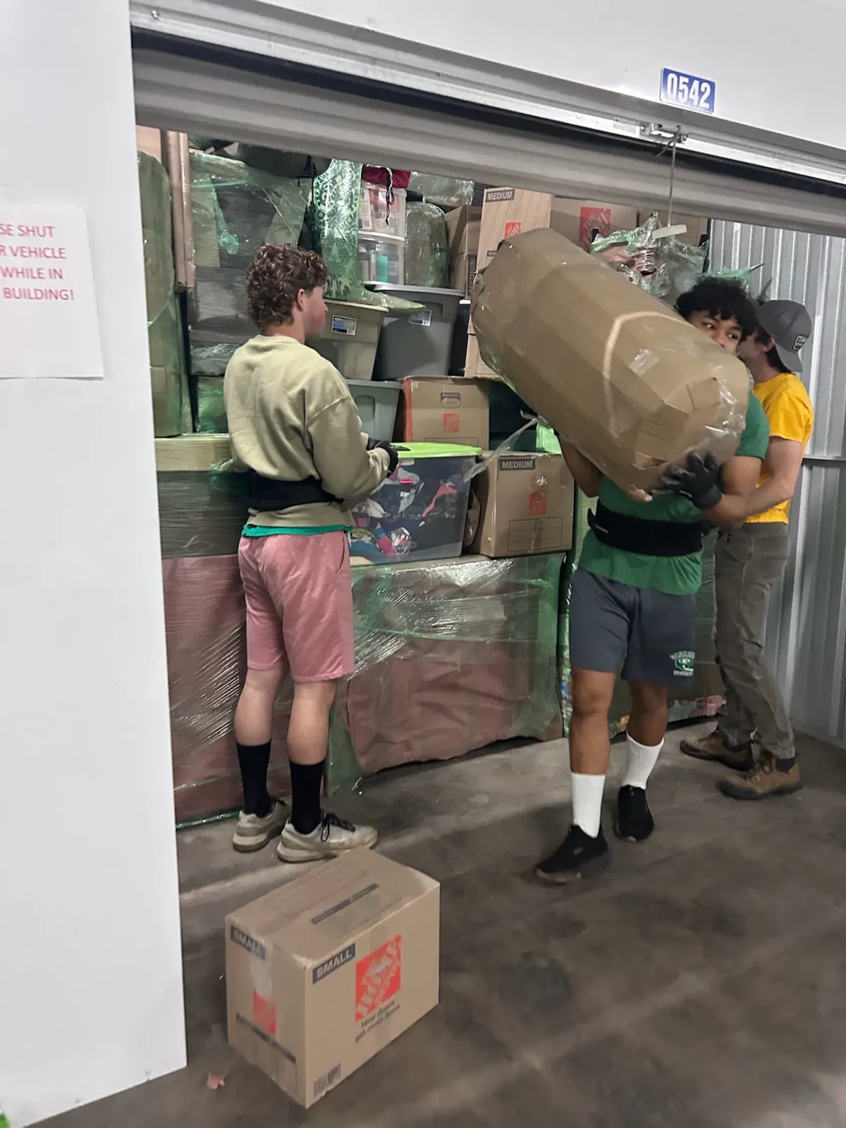 ClearPath crew loading wrapped furniture and boxes into a storage unit
