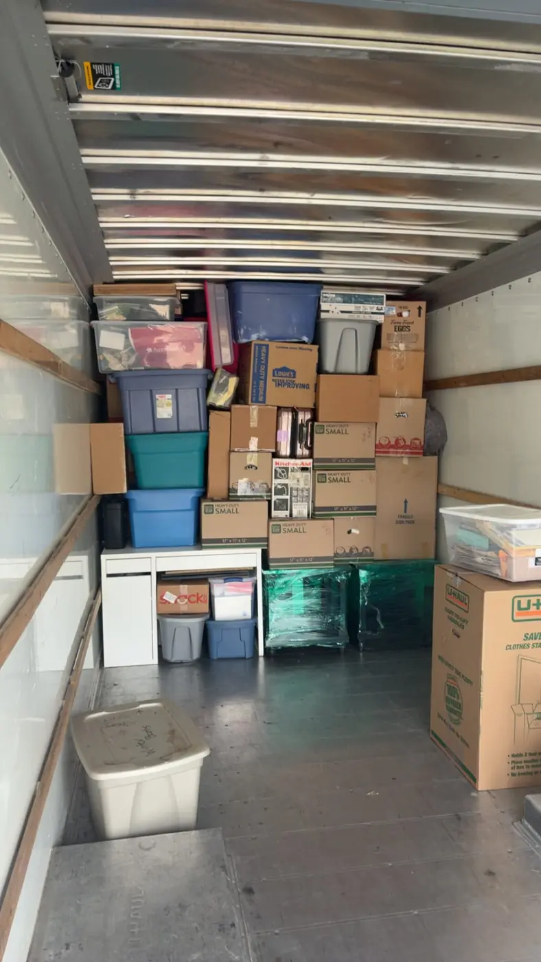 Boxes and totes stacked tightly inside a ClearPath moving truck
